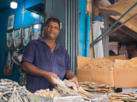 Market Vendor Sells Dried Fish in a Busy Street in Colombo Market