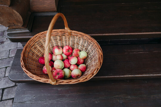 Bountiful Harvest of Apples in a Rustic Wooden Basket
