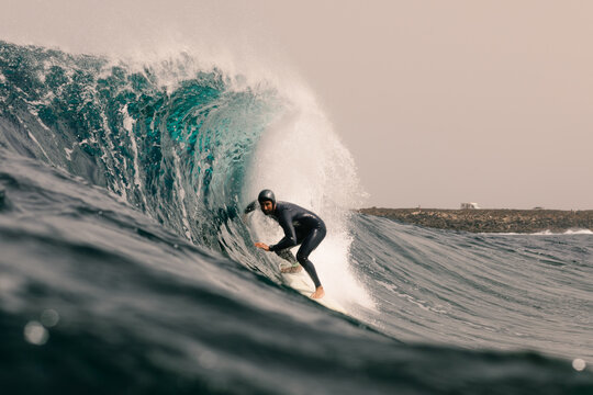 An experienced surfer practices offshore near Lanzarote&rsquo;s coast