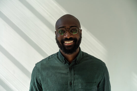 Black Man Wearing Glasses and Casual Green Shirt