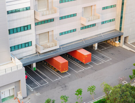 Modern Logistics Warehouse with Red Shipping Containers