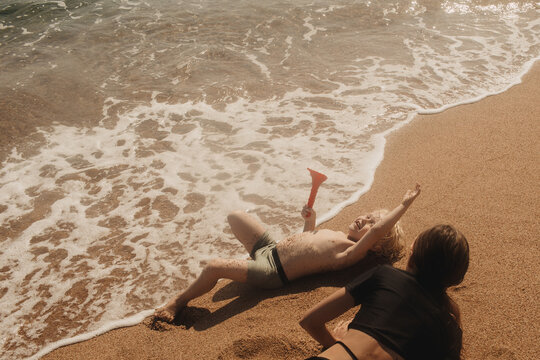 The children are playing on the beach