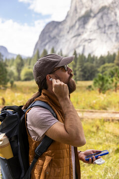 Cell Phone earbud in ear music hike Photo Yosemite Park  