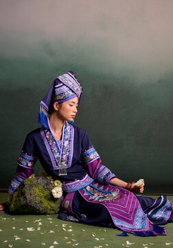 Chinese woman wearing traditional Zhuang ethnic attire.