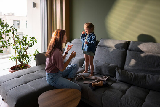 Parent comforting upset child at home