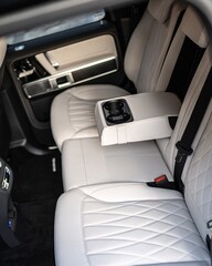Obraz premium Luxurious Car Interior With Quilted Leather Seats and Center Console.