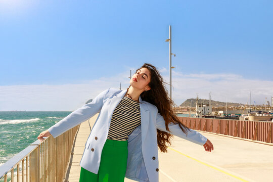 Model Enjoys a Sunny Day by the Sea 