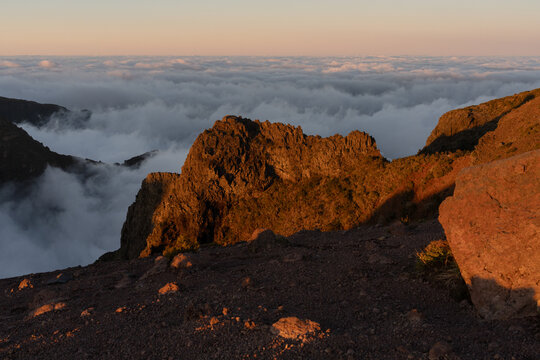 Mountain landscape above clouds at golden hour Madeira