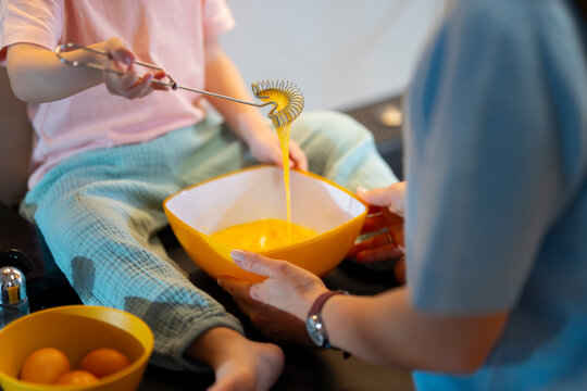 Preparing a dish with family in a cozy kitchen