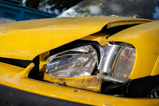 Detail of a yellow car after an accident