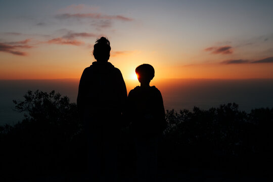 Silhouetted couple watching sunset on La Palma viewpoint