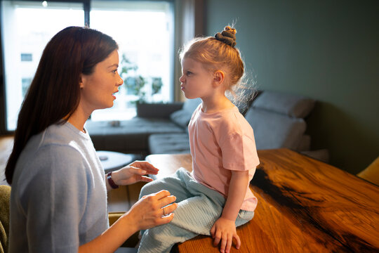 Mother and child share a moment at home