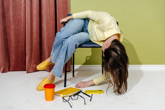 Overworked Woman Hanging Backward on Chair After Busy Day