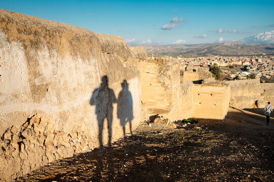 Shadow of two people on an ancient wall in Fes, Morocco