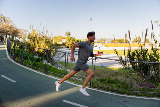 Runner Striding On Path