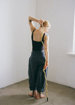 Woman posing with a stick