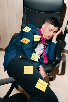 Employee Asleep at Desk With Sticky Notes During Work Hours in Office