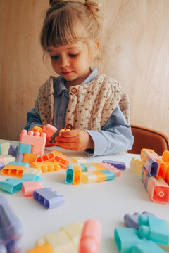 Toddler girl playing with blocks