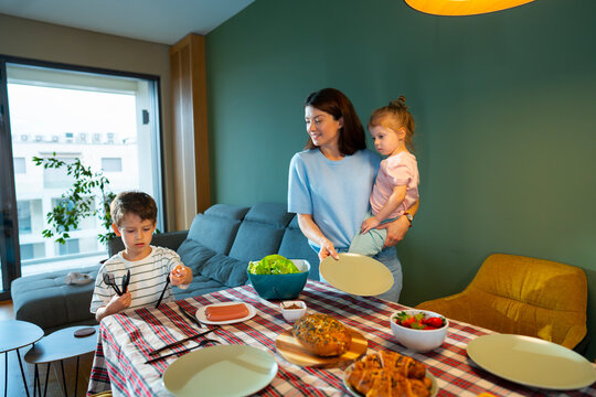 Family Setting Table Together at Home