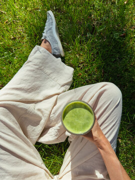 POV Drinking Healthy Green Smoothie Outdoors