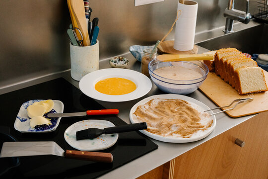 Kitchen countertop arranged with all ingredients for making Torrijas