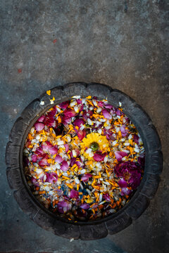 Floating Petals in Rustic Bowl on Stone Floor