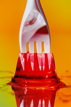 Plastic fork in red jelly