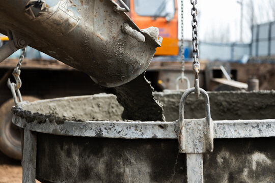 Pouring concrete into bucket