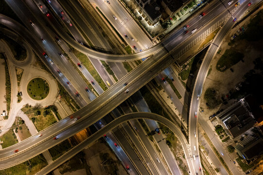 Aerial view of complex highway interchange at night