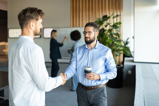Businessmen shaking hands during meeting