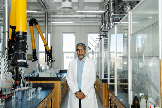  Indian scientist in white coat working in laboratory