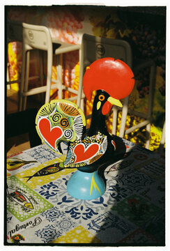 Traditional Portuguese rooster souvenir on table in Porto Portugal