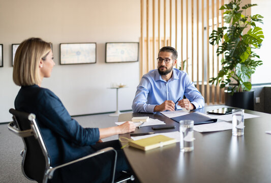 Man and woman talking during job interview