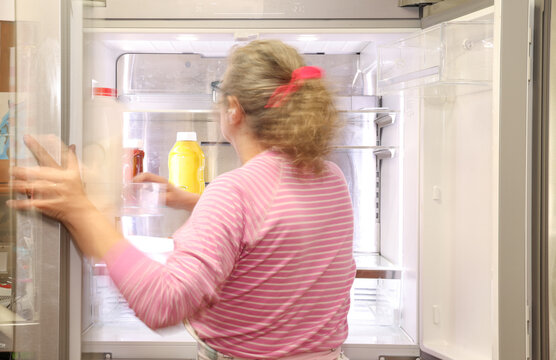 Woman Cleaning Refrigerator