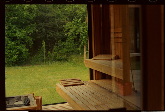 Wooden sauna interior with forest view