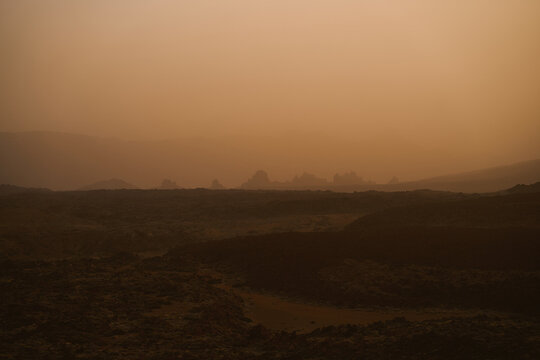 Volcanic Rock Desert Landscape With Rugged Sand Dunes 