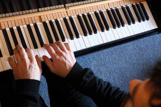 Pianist hands top view during a piano practice