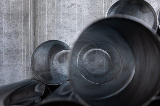 Stacked metal pipes side view