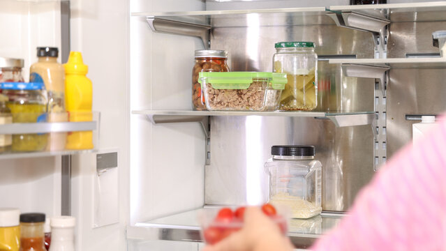 Woman Cleaning Refrigerator