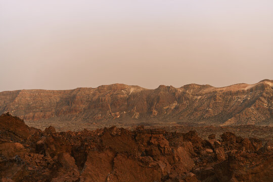 Volcanic Rock Desert Landscape With Rugged Sand Dunes 