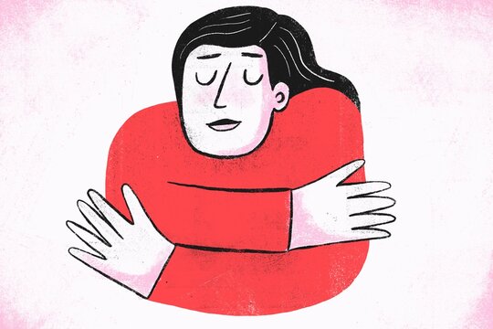Girl hugging herself