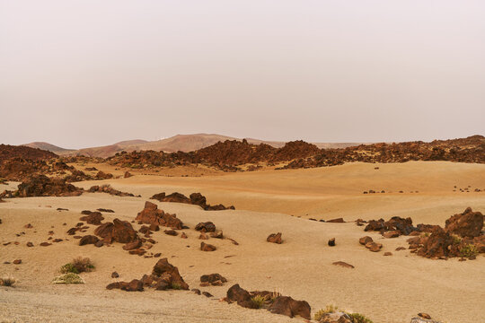 Volcanic Rock Desert Landscape With Rugged Sand Dunes 