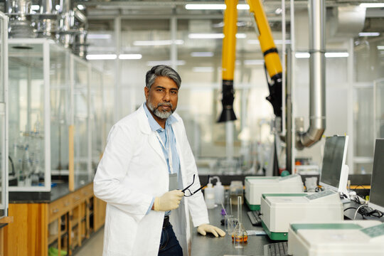  Indian scientist in white coat working in laboratory