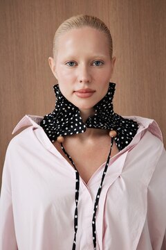 Portrait serious woman in stylish scarf