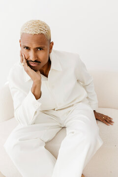 Man with blond hair resting face
