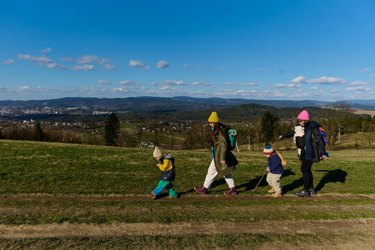 Family hiking together in countryside landscape