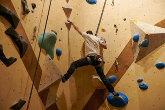 Man Rock Climbing