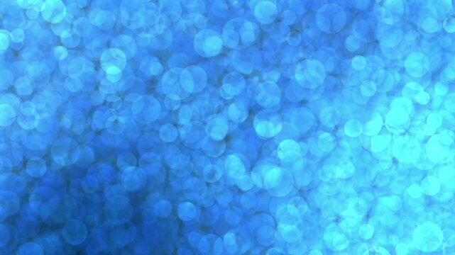 An abstract animated background featuring a soft, sparkling expanse of bokeh circles or blue bubbles. 