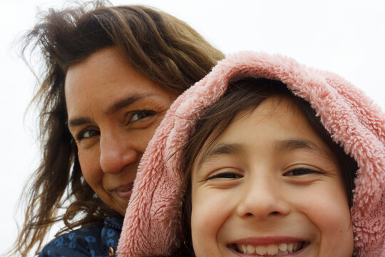 Smiling Woman and Girl Enjoying Time Outdoors Together