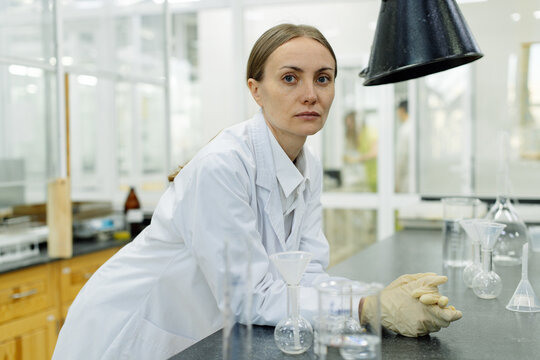 Young female lab assistant portrait in real laboratory setting